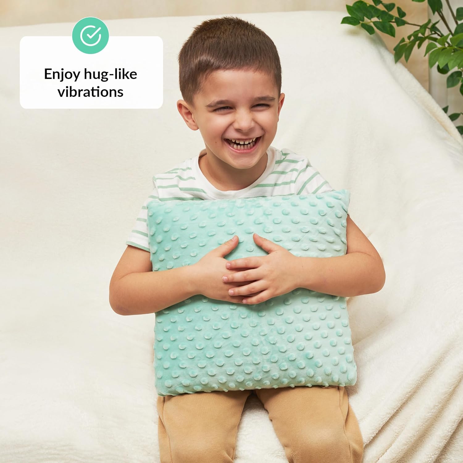 Child holding a textured pillow with a text overlay about vibrations